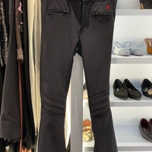 PERFECT MOMENT AURORA SKI PANTS Black Flared Pants with Red Star Detail